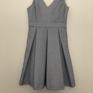 Blue and white dress with bow and open back